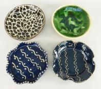 FOUR EWENNY CLAYPITS POTTERY SHALLOW DISHES, two blue and cream glazed with crimped edges, a brown