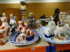 ASSORTED STAFFORDSHIRE POTTERY including two blue and white platters, animal spill-holders, seated
