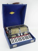 RUSSIAN PIANO ACCORDION IN GREY MARBLED PLASTIC & CHROME, in blue carry case