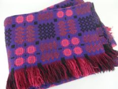 WELSH TAPESTRY BLANKET woven in purple with black and salmon detailing, fringe border