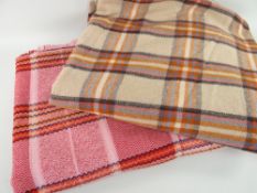 TWO TRADITIONAL BLANKETS, one pink, orange and black plaid with blanket stitched edge, and another