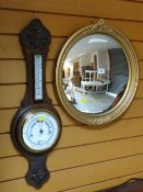 GILT FRAMED CONVEX WALL MIRROR and a carved oak banjo barometer