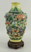 CHINESE FAMILLE VERTE BISCUIT VASE moulded in high relief with Buddist lions amid clouds and brocade