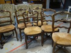 SET OF SIX CONTINENTAL CARVED RUSH SEATED DINING CHAIRS