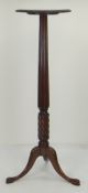 MAHOGANY TORCHERE with reeded column and wrythen twisted base, triple cabriole legs, 136cms high