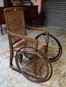 VINTAGE 'MONK & CO. OF BATH' BATH-CHAIR with twin wheels, with cane-work seat and back, bears