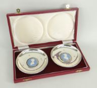 CASED PAIR OF COMMEMORATIVE SILVER CHARLES & DIANA CROWN DISHES, both having inset Wedgwood