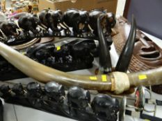 ASSORTED EXOTIC COLLECTABLES including three ebony elephant bridges, wall mounting long-horn trophy,