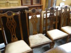 SET OF FOUR CARVED DINING CHAIRS with high Chippendale style splat backs