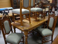 MODERN OAK DINING TABLE with six carved and upholstered antique style dining chairs
