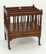 VINTAGE THREE SECTION CARVED MAHOGANY CANTERBURY with base drawer on caster supports, 56cms wide