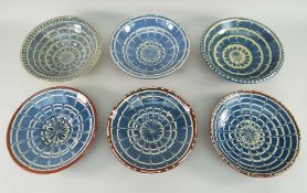 SIX EWENNY CLAYPITS POTTERY SHALLOW DISHES, blue and cream decoration including three with brown