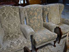 THREE PARER KNOLL WING-BACK FIRESIDE ARMCHAIRS in various floral upholstery