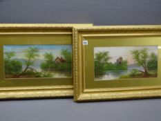 VICTORIAN WATERCOLOURS, a pair - lakeside scenes with buildings in gilt frames, 19 x 38cms