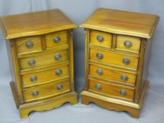 REPRODUCTION MAHOGANY BEDSIDE CHESTS, a pair, having two small over three larger drawers with ring-