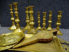 BRASS CANDLESTICKS, (four pairs), brass bellows, tray and similar items