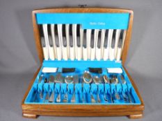 CUTLERY SET, CASED INITIAL STAINLESS STEEL by Sipelia (appears as new)