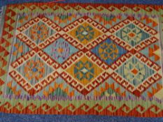 VEGETABLE DYE WOOL CHOBI KILIM RUG - colourful central repeat diamond pattern with a red and green