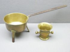 BRASSWARE - early skillet pan on three feet with an iron handle and a mortar