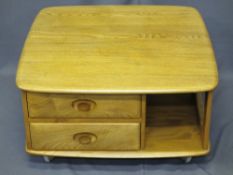 MID-CENTURY ERCOL LIGHT ELM TWO DRAWER SQUARE COFFEE TABLE on castors, 39.5cms H, 80 x 80cms top