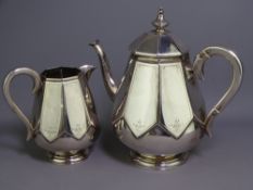DUTCH SILVER TEAPOT & MILK JUG, segmented form with simple floral chasing on circular pedestal feet,