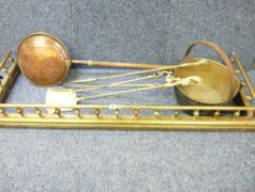 BRASS FIRE FENDER - well presented with a gallery top, fire irons, long-handled warming pan and a