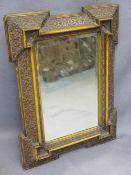 VICTORIAN CARVED CUSHION FORM WALL MIRROR with bevelled edge glass, 59cms H. 44cms W