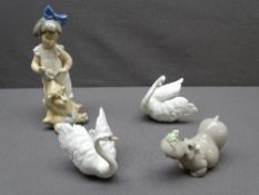 NAO - a young girl with a lion, a hippo with a frog on its nose and a pair of Lladro white swans