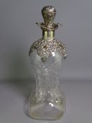 SILVER MOUNTED PINCHED WAIST DECANTER, swirl form glass with pierced shoulder mount, flared collar