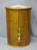 REPRODUCTION OAK BOW FRONT HANGING CORNER CUPBOARD, 86.5cms H, 53cms W