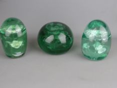 VICTORIAN GREEN GLASS DUMP PAPERWEIGHTS x 3, all having internal potted plant and floral decoration,