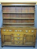 ANGLESEY NORTH WALES OAK DRESSER, shape sided three shelf rack with wide back boards over a two