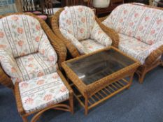 WICKER CONSERVATORY SUITE, five piece including two seater settee, pair of armchairs, foot stool and