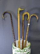 SILVER COLOURED & OTHER WALKING STICKS and a porcelain stick stand
