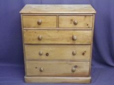 VICTORIAN STRIPPED PINE CHEST of two short over three long drawers, having turned wooden knobs on