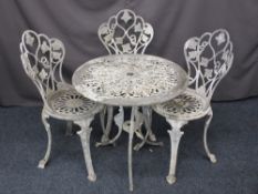 PAINTED METAL GARDEN SET of circular topped table and three chairs, various measurements