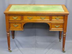 VINTAGE OAK DESK, the top having green cloth insert over an arrangement of five drawers with brass