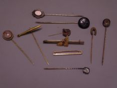9CT GOLD BEE BROOCH, eight various stick pins ETC, the pins with various mounted tops including a