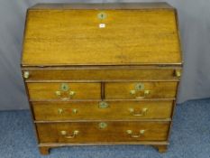 A GEORGIAN OAK FALL-FRONT BUREAU with interior sliding well and mixed drawer and pigeonhole