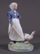 ROYAL COPENHAGEN FIGURINE of a young maiden with a goose, no '067' to the base
