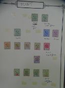 LARGE OLD LEATHER SPINED ALBUM containing Sarawak, Hong Kong, Commonwealth and India samples