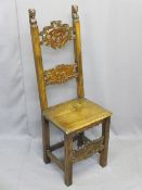 SPANISH WALNUT SIDE CHAIR, 18th century with carved panels of animals and carved head uprights,