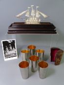 CASED W M F BEAKERS and a silver model boat, 6 gilt lined 8.5cms height beakers, the largest stamped