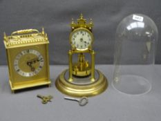 A DOMED PENDULUM MANTEL CLOCK and another brass effect mantel clock