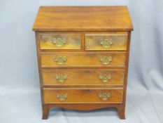 NEATLY PROPORTIONED REPRODUCTION MAHOGANY CHEST of two short over three long drawers with fancy