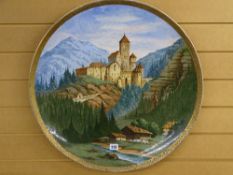 LARGE AUSTRIAN? POTTERY WALL CHARGER depicting an alpine scene, marked 'Burg Taufers in Tirol',