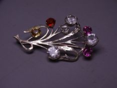 POSSIBLY SILVER FLORAL SPRAY BROOCH having one diamond of visual estimate 0.35cts together with