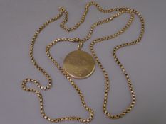 FINE CIRCULAR 9CT MONOGRAMMED LOCKET, 7.5grms and a muff chain, total weight 21.7grms