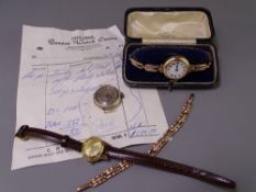 WATCHES - a lady's 9ct gold encased wrist watch with white enamel dial and Roman numerals and with
