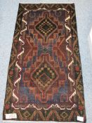 OLD BALUCHI - multi dark tonal colours with a double block central pattern, the edge highlighted